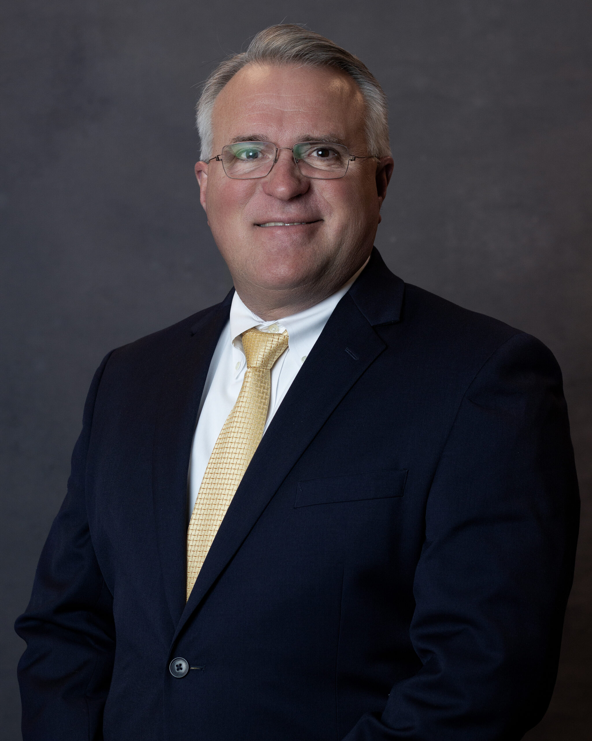 Professional headshot of Adam S. Hicks