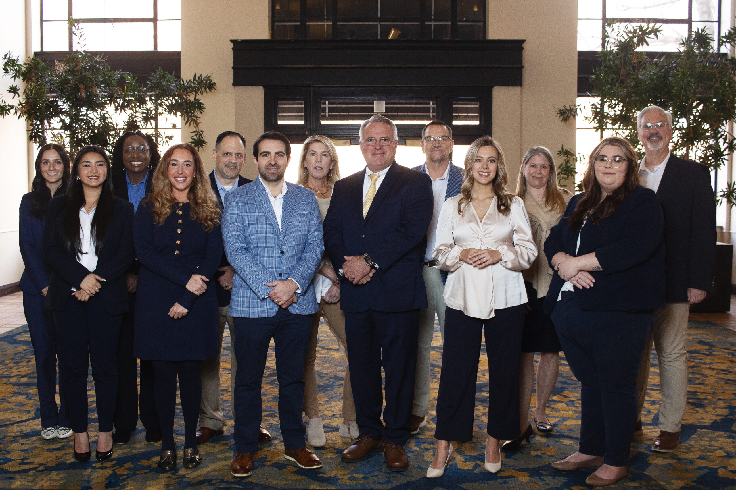 Group photo of Lanier Legacy Group staff in professional dress